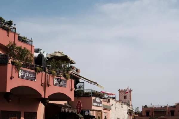 Pink buildings stand against a bright, clear sky.