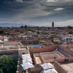 a view of a city with a clock tower in the distance