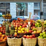 a bunch of baskets filled with different types of fruit